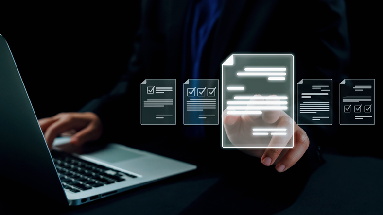 A person using a laptop interacts with a virtual interface displaying holographic documents and checklists, representing RAG AI (Retrieval-Augmented Generation Artificial Intelligence) technology in action.